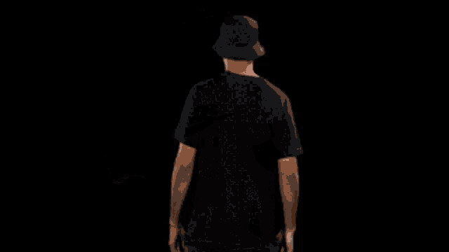 a man wearing a black nike air t shirt