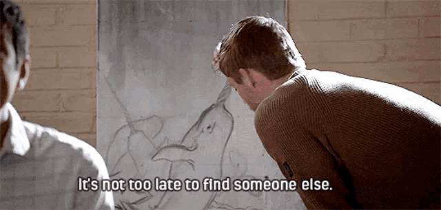 a man is looking at a painting on a wall and says `` it 's not too late to find someone else ''