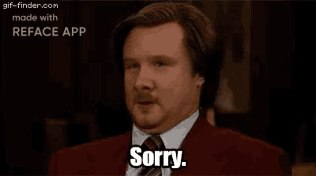 a man with a mustache is wearing a red suit and tie and saying sorry .