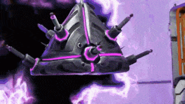 a purple and black object is flying in the air in a room .
