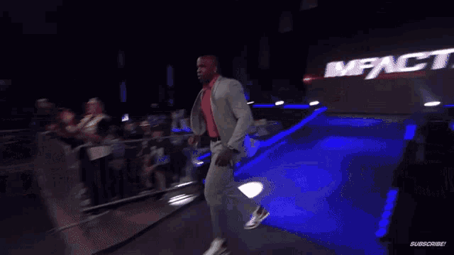 a wrestling ring with a sign that says " impact " on it