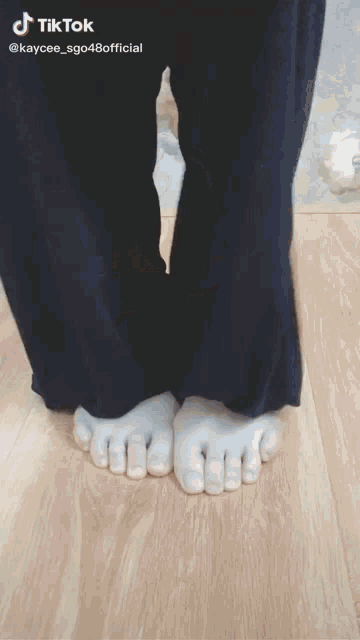 a tiktok video of a person 's legs and feet