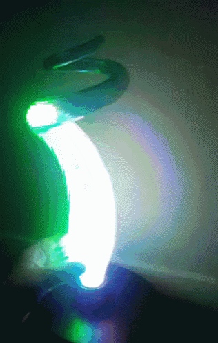 a swirl of green and blue lights with the letter s on it
