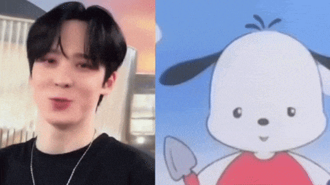 a man is standing next to a picture of a cartoon dog .
