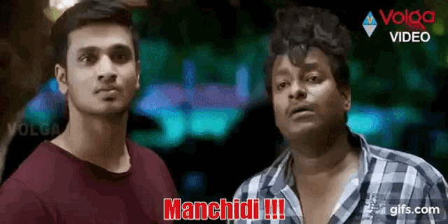 two men are standing next to each other and one of them is saying manchidi !!