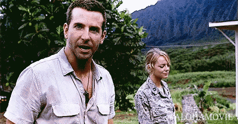 a man in a white shirt stands next to a woman in a military uniform with the word alohamovie written on the bottom