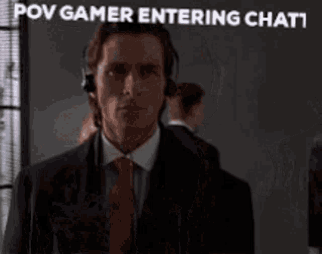 a man in a suit and tie is wearing headphones and the caption says pov gamer entering chat !