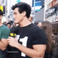 a man wearing a black t-shirt with the number 1 on it