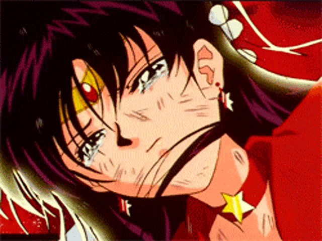 a close up of a woman 's face with tears running down her cheeks