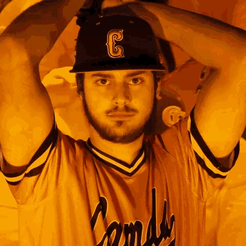 a man wearing a jersey that says candy on it