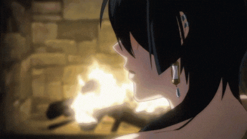 a close up of a girl 's face with a fire in the background