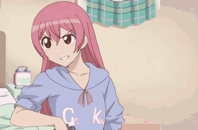 a girl with pink hair is pointing a gun at another girl who is wearing a shirt that says gs kw