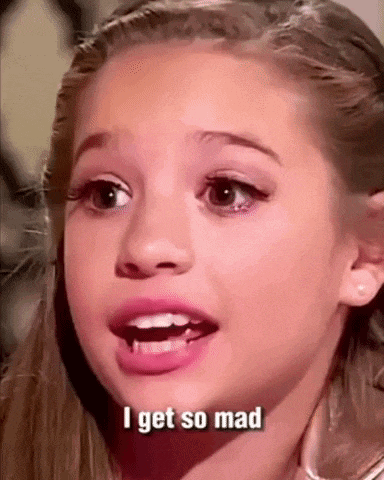 a young girl is making a face and saying `` i get so mad '' .