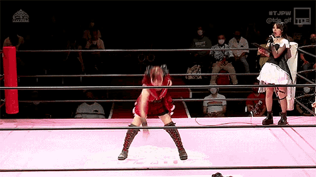 two women in a wrestling ring with the words #tjpw on the bottom