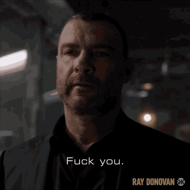 a close up of a man 's face with the words " fuck you " on the bottom