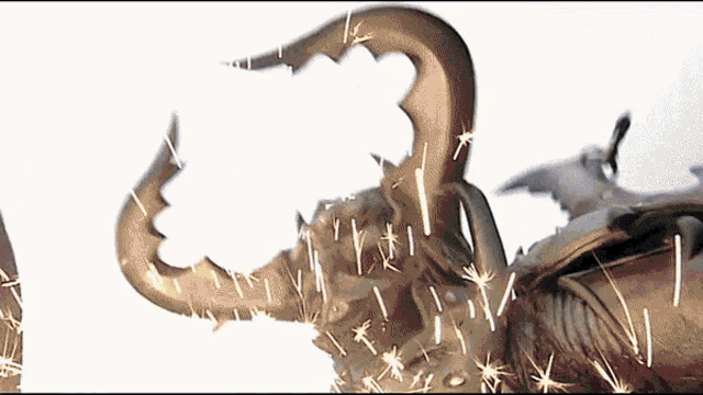 a close up of a statue with sparks coming out of the horns