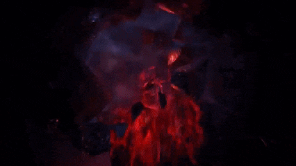 a computer generated image of a statue of a man standing on top of a volcano .