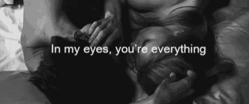 a black and white photo of a man and woman with the words in my eyes you 're everything above them