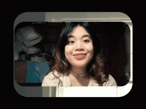 a woman in a white shirt is smiling in a black frame