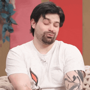 a man with a beard is wearing a white t-shirt with a bunny on it
