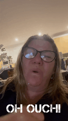 a woman with glasses says oh ouch