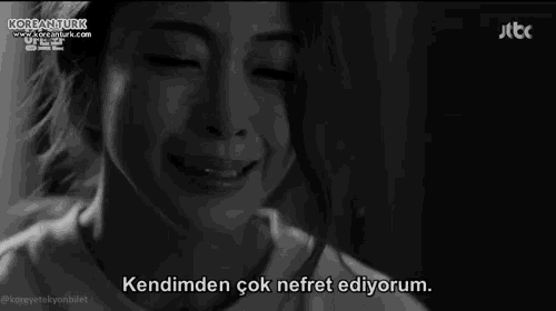 a black and white photo of a woman crying with korean turk on the bottom left
