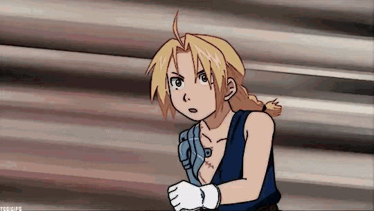 a cartoon character is standing in front of a wall looking at something .