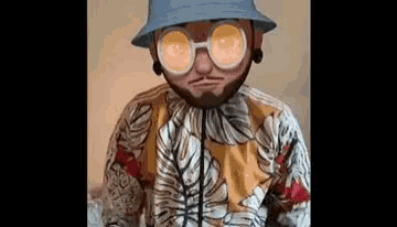 a man wearing a hat , sunglasses and a hawaiian shirt is making a cartoon face .