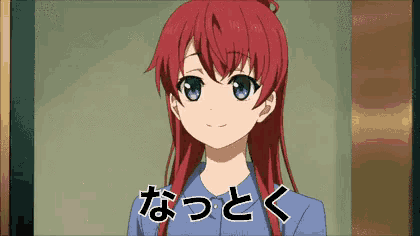a girl with red hair and blue eyes is standing in front of a sign that says ' n ' on it