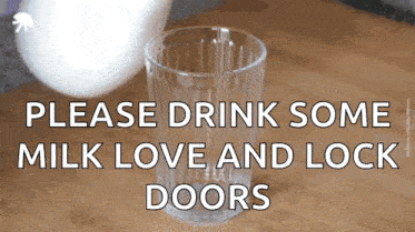 a glass of milk sits on a wooden table with the words " please drink some milk love and lock doors "