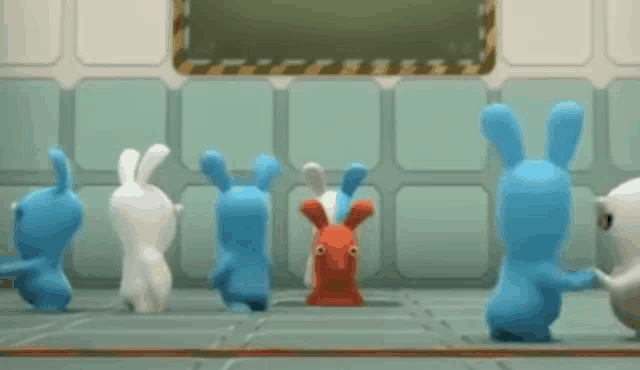 a group of blue and white bunny rabbits are dancing together