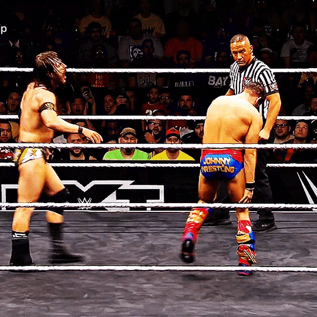 a wrestler with johnny wrestling on his shorts