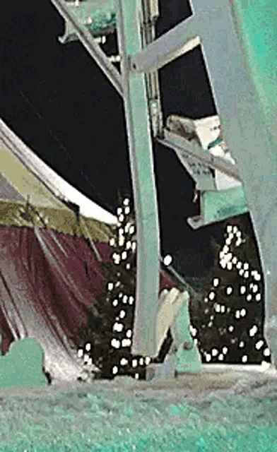 a close up of a water slide at night