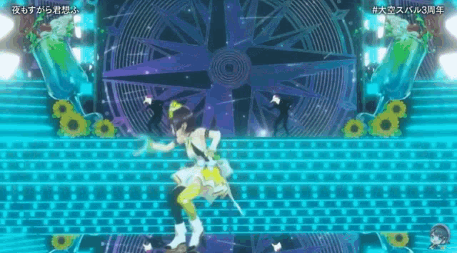 a girl is dancing on a stage in front of a large compass .
