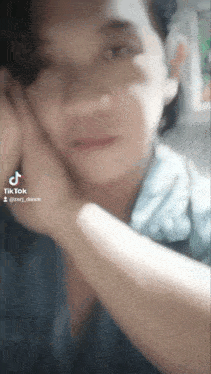 a close up of a person 's face with a tik tok watermark on it