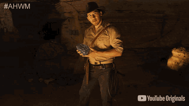 a man in a cowboy hat is giving a thumbs up next to a youtube originals logo