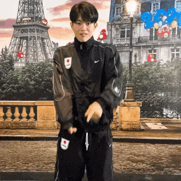 a man wearing a nike jacket has a patch on his sleeve that says ' japan '