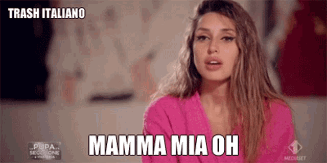 a woman in a pink robe says mamma mia oh in a foreign language