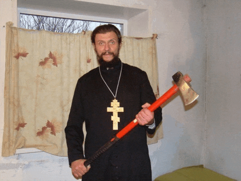 a man with a cross around his neck is holding a red axe