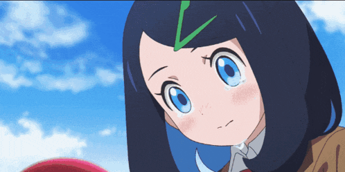 a girl with blue eyes and a green v on her head is crying