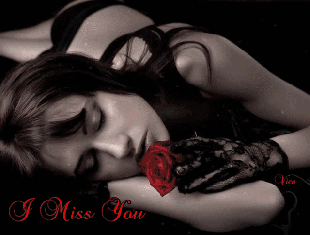a woman laying down with a rose in her mouth and the words " i miss you " behind her
