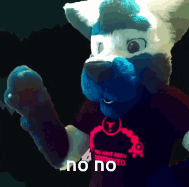 a blue and white furry animal is wearing a shirt that says no no