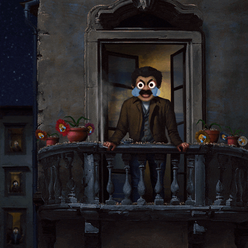 a man on a balcony with flowers in pots