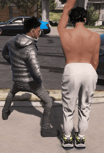 a man wearing a mask stands next to a shirtless man in sweatpants