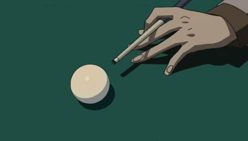 a person is holding a pool cue and a pool ball