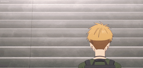 a man with a backpack is standing in front of a set of stairs .