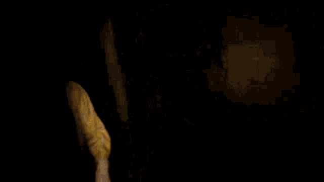 a man with glasses and a beard is wearing a yellow robe