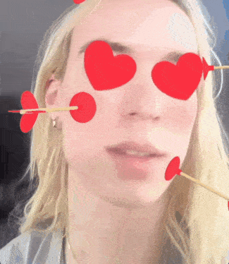 a woman with arrows in her eyes and hearts in her eyes