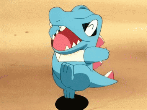 a cartoon pokemon is standing on a rock with its mouth open and its tongue out .