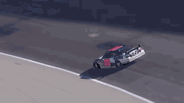a race car with the number 30 on it is going around a curve